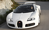 Bugatti Veyron 16.4 Grand Sport. Gama 2009. Imagen. Carrocer�a descapotable. Frontal lateral cenital. Movimiento. Carretera. Aler�n.
