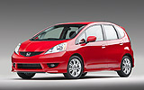 Honda Jazz. Modelo 2009. Imagen. Frontal- lateral. Coche parado. Estudio. Rojo.