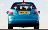 Honda Jazz. Modelo 2009. Imagen. Posterior. Coche parado. Carretera. Azul .