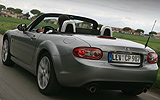 Mazda MX-5. Soft Top. Modelo 2009. Imagen exterior. Posterior. Movimiento. Carretera. Gris.