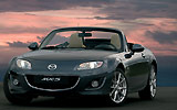 Mazda MX-5. Roadster Coup�. Modelo 2009. Imagen. Frontal- lateral. Coche parado. Descapotado. Carretera. Gris oscuro.