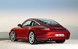 Porsche 911 Targa. Modelo 2009. Imagen. Lateral- posterior. Coche parado. Llantas Carrera S ll 19 pulgadas. Frenos de disco de compuesto cer�mico PCCB. Rojo rub� metalizado.