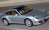 Porsche 911 Targa. Modelo 2009. Imagen. Exterior. Lateral frontal. Coche en movimiento. Carretera. Gris.