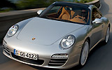 Porsche 911 Targa. Modelo 2009. Imagen. Exterior. Frontal lateral. Coche en movimiento. Carretera. Gris.