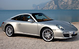 Porsche 911 Targa. Modelo 2009. Imagen. Exterior. Lateral frontal. Coche parado. Carretera. Gris.